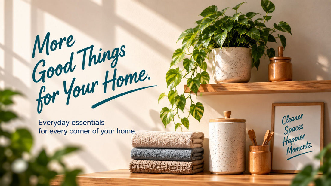 A sunlit shelf with folded cloths, ceramic jars and plants, lettered More Good Things for Your Home